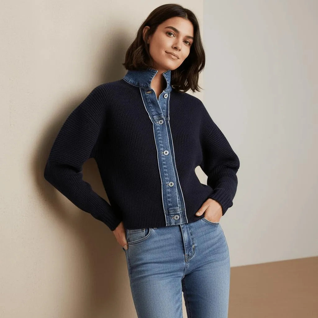 Woman in navy knit cardigan with denim collar, button front, and ribbed cuffs.