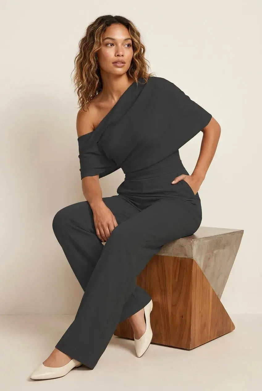 Jumpsuit one-shoulder zwart draperende halslijn