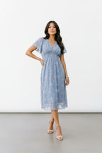 Women's dress blue floral overlay front pose hand on hip