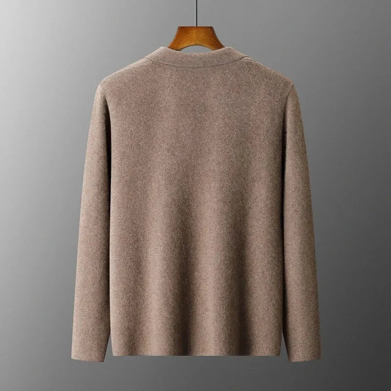 Bruine damesblazer van 100% gekamde cashmere met een getailleerde pasvorm, hangend aan een kledinghanger.