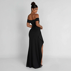 Robe longue femme en tissu léger, épaules dénudées, élégante fente sur le côté pour un look moderne et aéré.