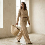A different brunette woman, mid-length wavy hair, natural makeup, 

slim build, holding a woven straw tote bag, minimalist studio 

background warm off-white, soft diffused lighting, high-end fashion 

editorial style, photorealistic, high resolution, different person 

than reference, random natural pose, unexpected angle, 

use other pose for every photo