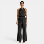 Ensemble noir femme : top col halter décolleté V, pantalon large taille élastiquée.